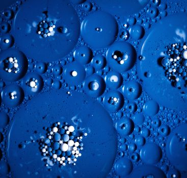 abstract background colored milk balls in oil