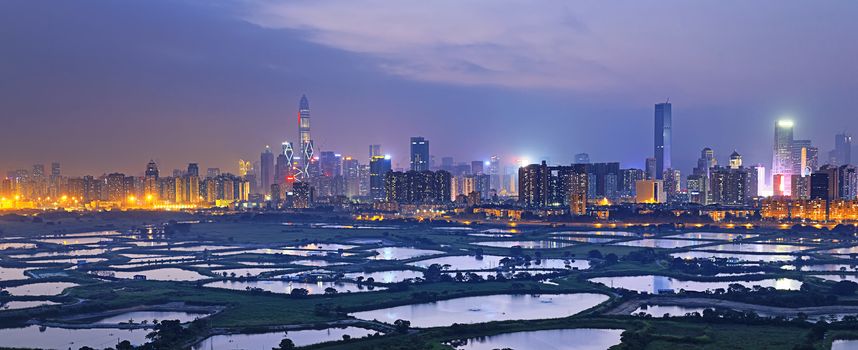 Shenzhen citscape at night , view from hiong kong countryside