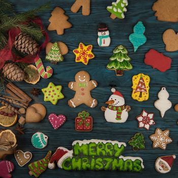 Gingerbreads for new years and christmas on wooden background, xmas theme