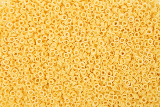 Small anellini pasta rings background texture. Italian Cuisine