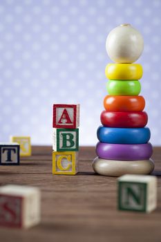 Children's World toy on a wooden background. Studio shot]