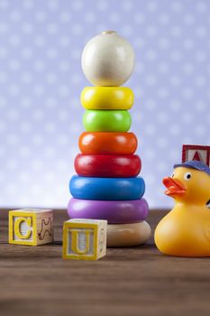 Children's World toy on a wooden background. Studio shot]