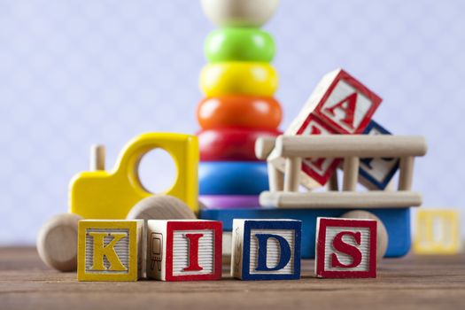 Children's World toy on a wooden background. Studio shot]