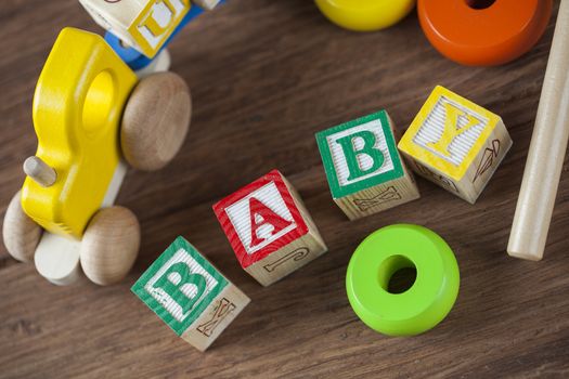 Children's World toy on a wooden background. Studio shot]