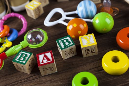 Children's World toy on a wooden background. Studio shot]