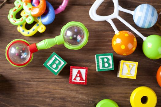 Children's World toy on a wooden background. Studio shot]