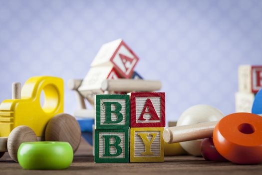 Children's World toy on a wooden background. Studio shot]