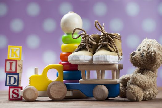 Children's World toy on a wooden background. Studio shot]