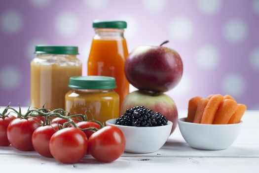 healthy ready-made baby food on a wooden table.