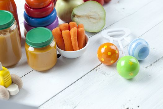 healthy ready-made baby food on a wooden table.