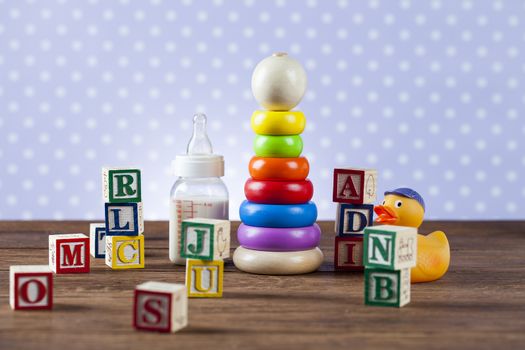 Children's World toy on a wooden background. Studio shot]