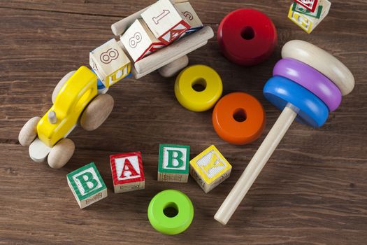 Children's World toy on a wooden background. Studio shot]