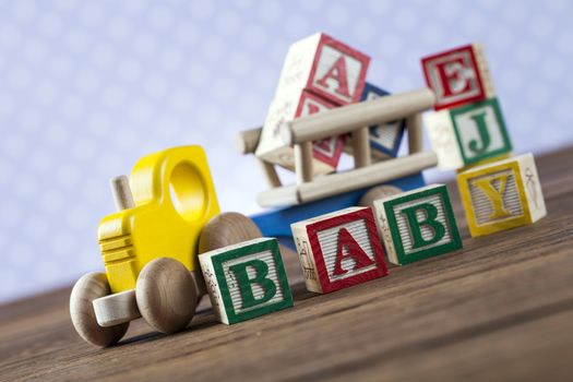 Children's World toy on a wooden background. Studio shot]