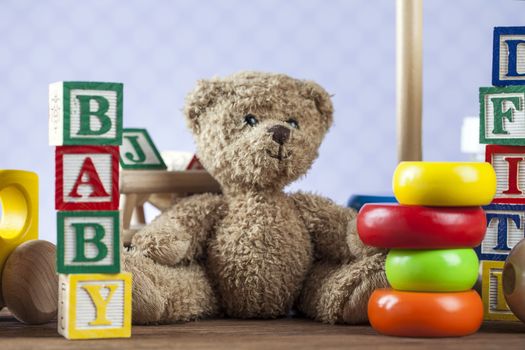 Children's World toy on a wooden background. Studio shot]