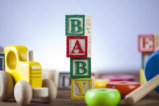 Children's World toy on a wooden background. Studio shot]