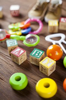 Children's World toy on a wooden background. Studio shot]