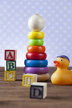 Children's World toy on a wooden background. Studio shot]