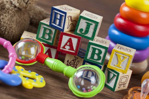 Children's World toy on a wooden background. Studio shot]