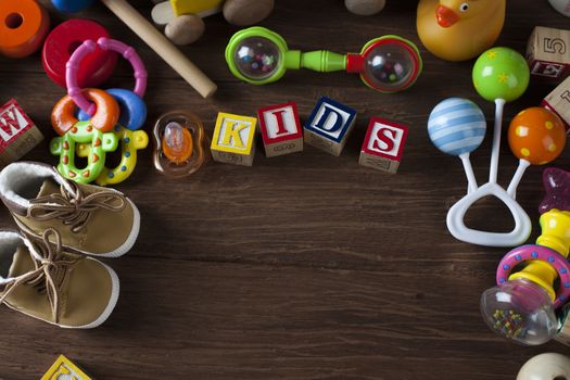 Children's World toy on a wooden background. Studio shot]