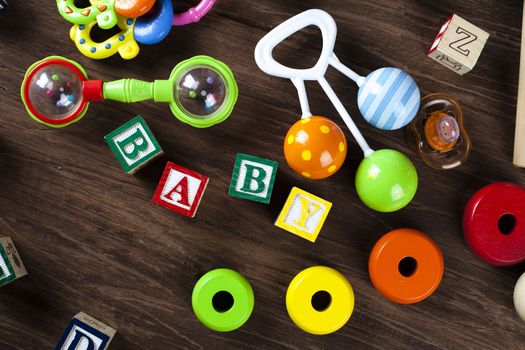 Children's World toy on a wooden background. Studio shot]