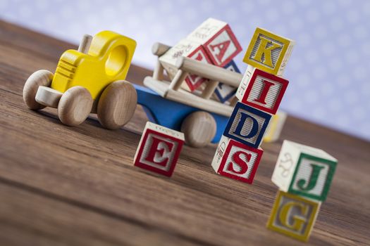 Children's World toy on a wooden background. Studio shot]