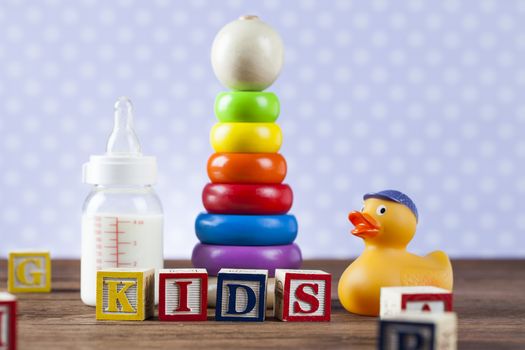 Children's World toy on a wooden background. Studio shot]