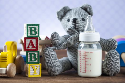 Children's World toy on a wooden background. Studio shot]