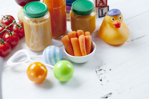 healthy ready-made baby food on a wooden table.