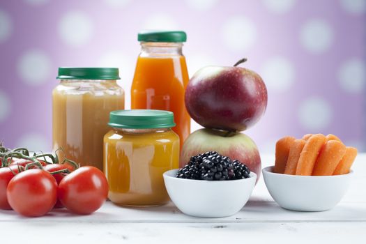 healthy ready-made baby food on a wooden table.