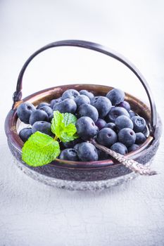 Fresh Blueberry and mint on a wooden table