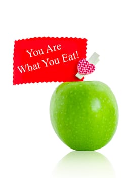 You are what you eat, health conceptual card with green apple isolated on white background, Save clipping path. Healthy concept.