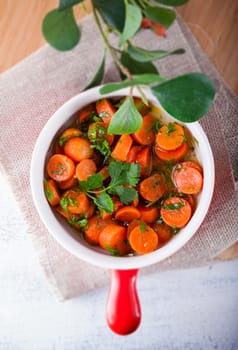 Baby carrots cooked with garlic, honey and parsley.