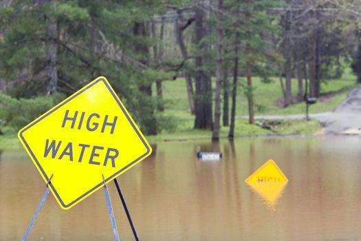 My street is closed off by flood waters,heavy rain for a week has pushed rivers over their banks & flood many homes and businesses 