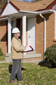 Home inspector looking for possible problems for a potential buyer, looking for needed repairs