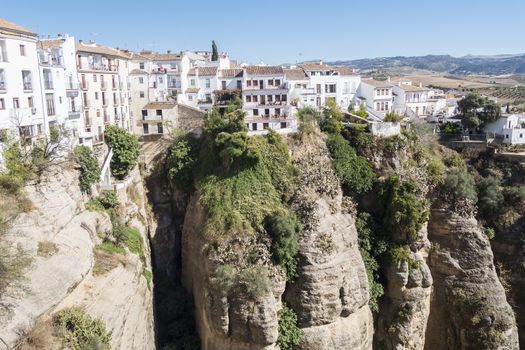 View from the new Bridge over Guadalevin River in Ronda, Malaga, Spain. Popular landmark in the evening