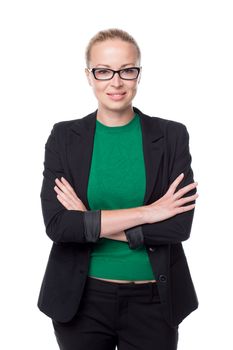 Portrait of beautiful smart young businesswoman in business attire wearin black eyeglasses, standing with arms crossed against white background.