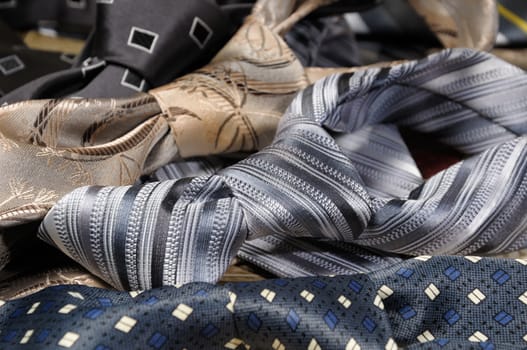 a variety of neckties knotted closeup