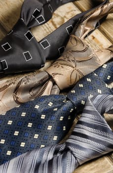 a variety of neckties knotted closeup
