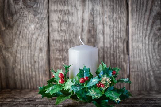 Christmas symbols including Candle on a wooden table