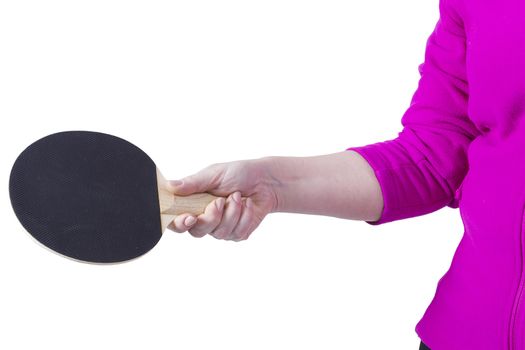 Active senior woman playing table tennis in front of white background
