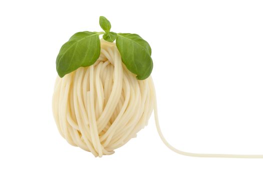spaghetti in shape ball with fresh basil on white