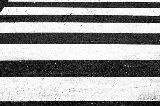 White painted pedestrian crossing on the road.