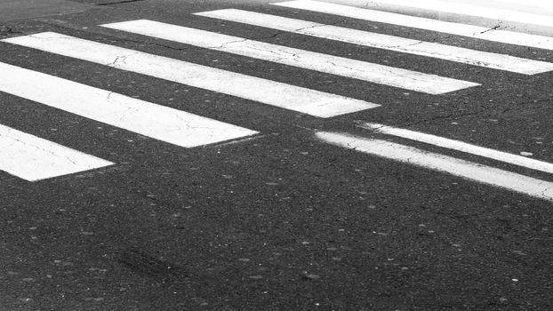 White painted pedestrian crossing on the road.