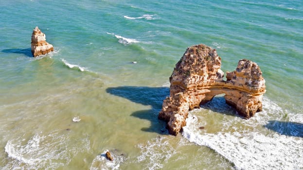 Aerial from rocks and ocean near Lagos in Portugal