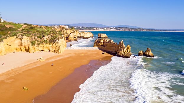 Aerial from rocks and ocean near Lagos in Portugal