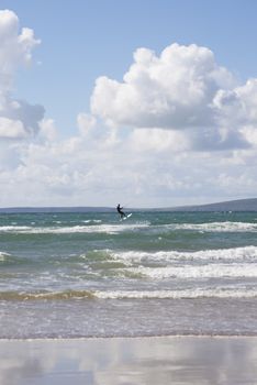 extreme kite surfer on beautiful waves at beach in ballybunion county kerry ireland on the wild atlantic way