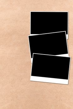 empty photographs on a background beige paper texture