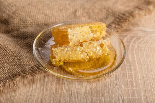 honeycomb with honey on the plate in a rustic style