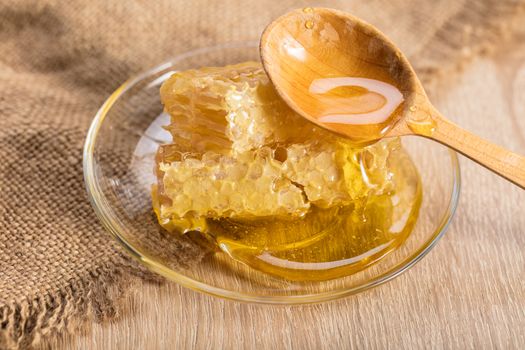 honeycomb with honey on the plate in a rustic style