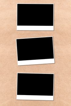 empty photographs on a background beige paper texture